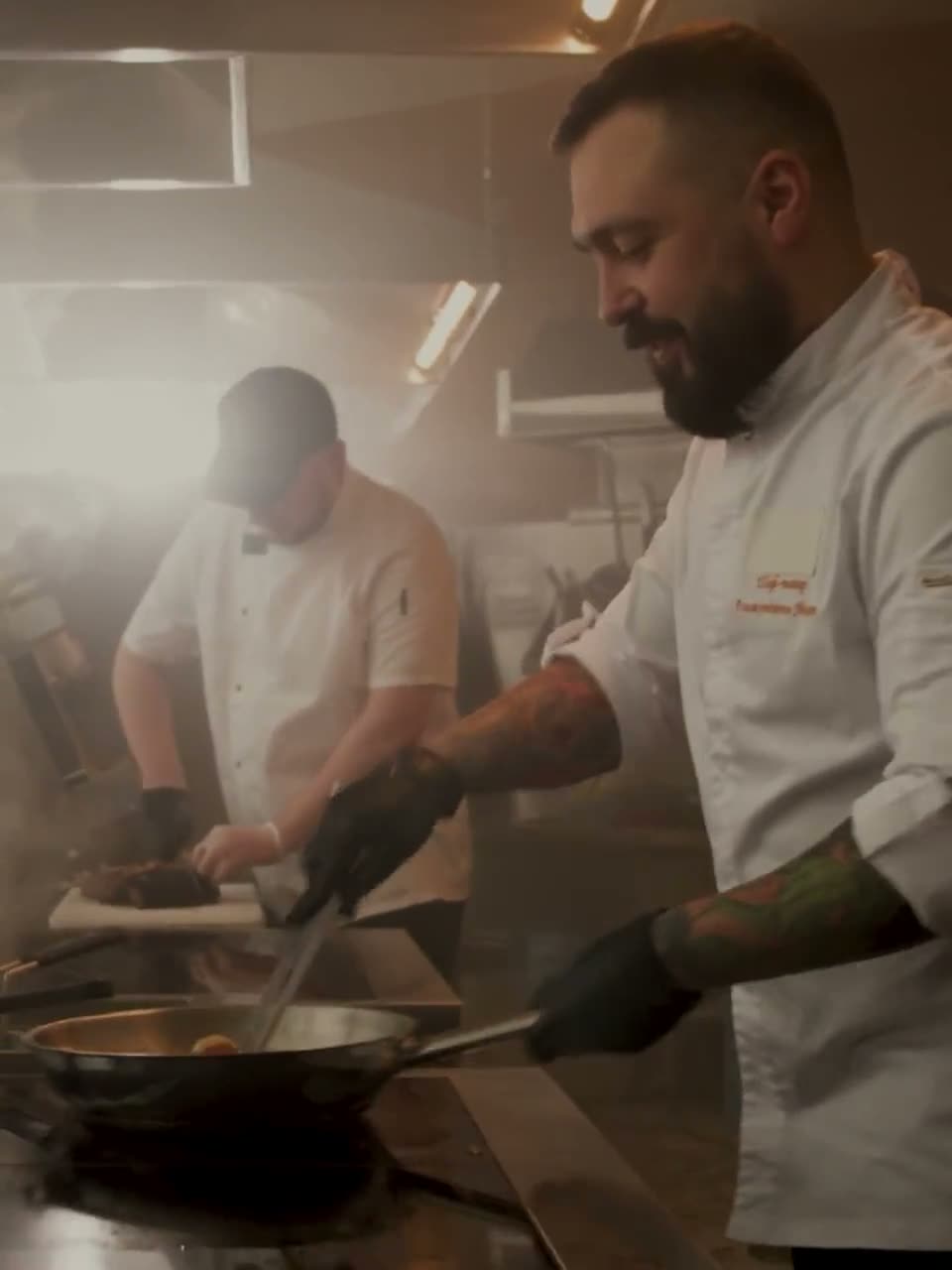PaidAnyday project — chefs cooking in a restaurant kitchen